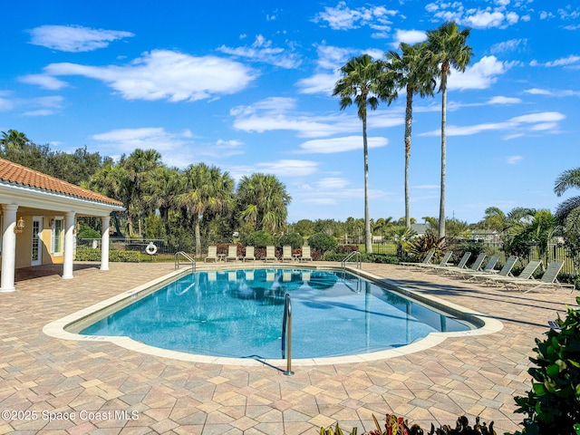 view of swimming pool with a patio