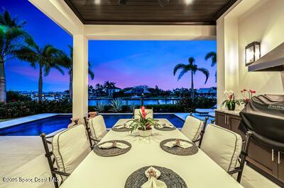 patio terrace at dusk featuring ceiling fan