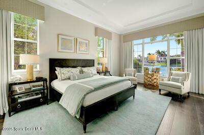 bedroom featuring multiple windows and hardwood / wood-style floors