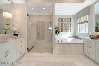 bathroom with vanity and independent shower and bath