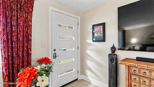 doorway featuring light hardwood / wood-style floors