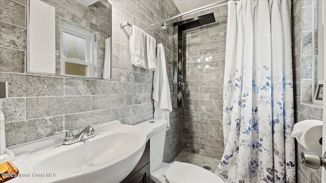 bathroom with vanity, toilet, tile walls, and a shower with shower curtain