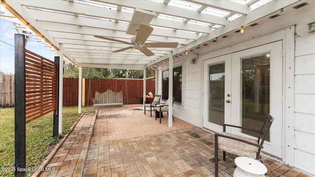 view of patio / terrace with ceiling fan and french doors