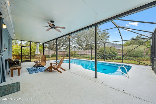 view of swimming pool with a lanai, a patio, and ceiling fan