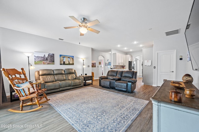 living room with hardwood / wood-style flooring and ceiling fan