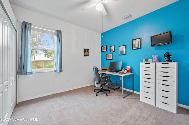 office area with ceiling fan, light carpet, and a textured ceiling