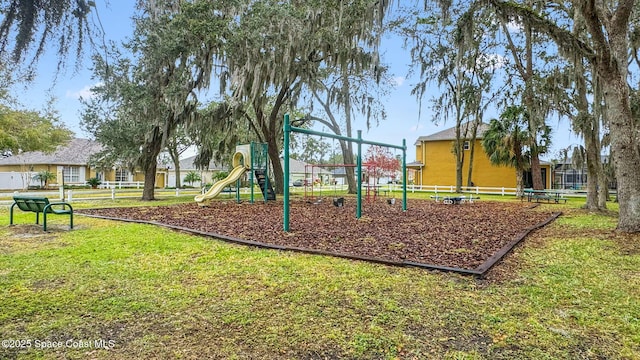 view of playground featuring a lawn