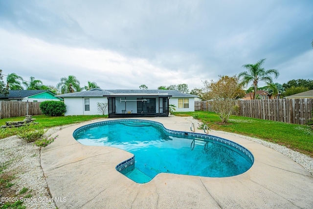 view of pool featuring a patio area and a lawn