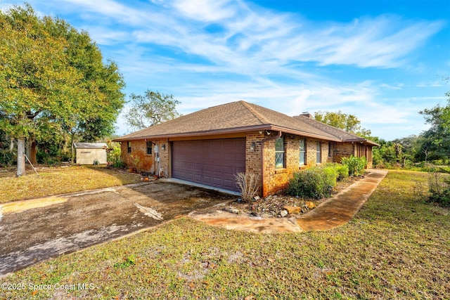 view of home's exterior featuring a yard and a garage