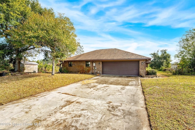 ranch-style house with a garage and a front lawn