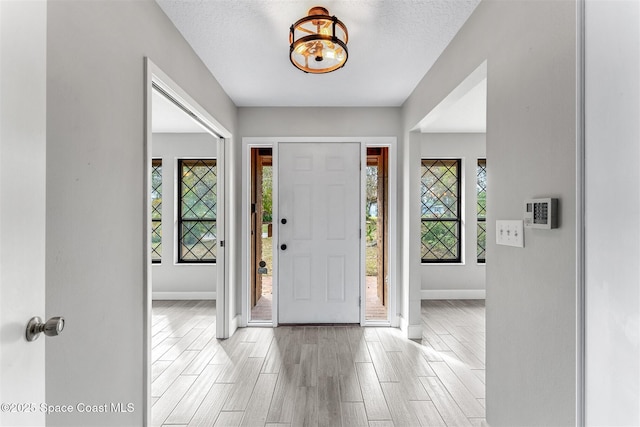 foyer featuring a textured ceiling