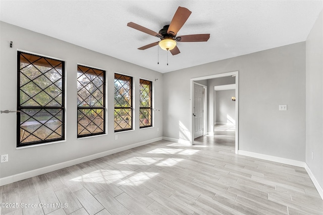 spare room with ceiling fan