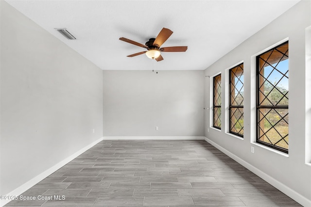 unfurnished room with ceiling fan