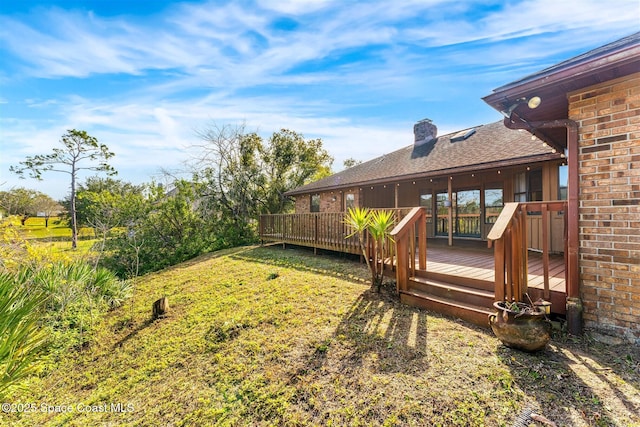 view of yard with a wooden deck