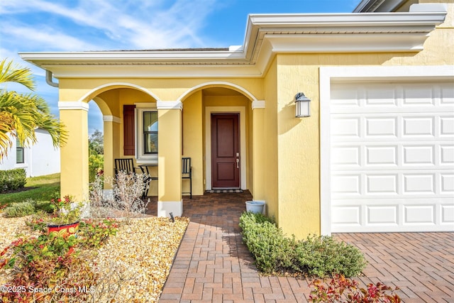 property entrance with a garage