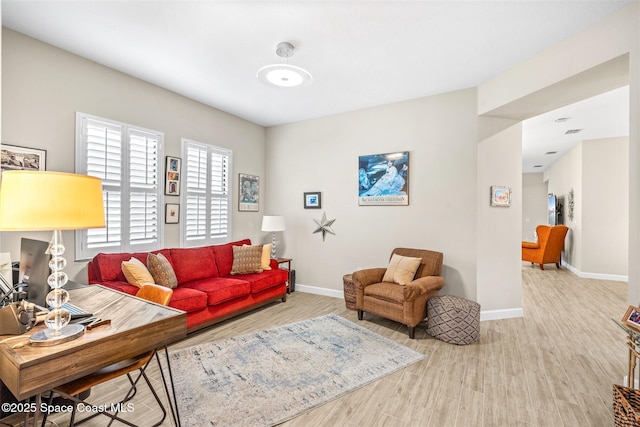 living room with light hardwood / wood-style floors