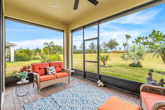 sunroom / solarium with ceiling fan