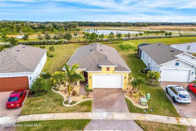 birds eye view of property with a water view