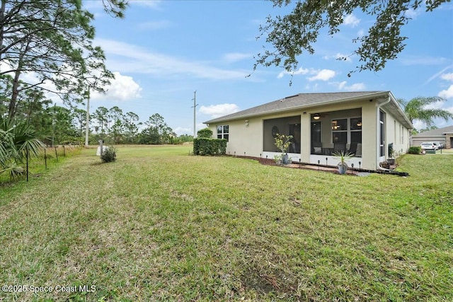 view of yard with a sunroom