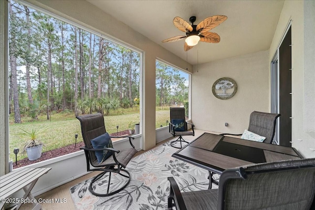 sunroom / solarium with ceiling fan