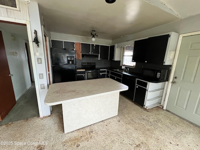 kitchen with a kitchen island, sink, and black appliances