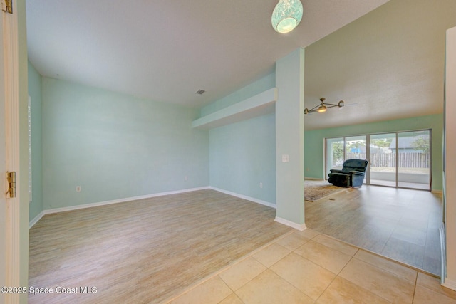 unfurnished room featuring light tile patterned floors