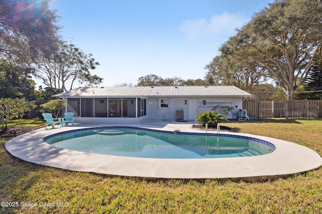 view of pool featuring a yard, a patio, a sunroom, and central air condition unit