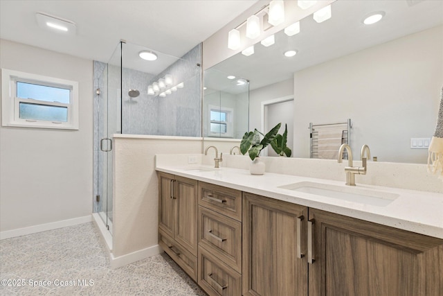 bathroom with walk in shower and vanity