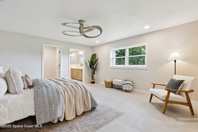 tiled bedroom featuring ceiling fan and ensuite bathroom