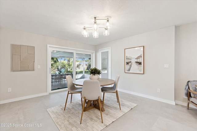 dining space featuring an inviting chandelier