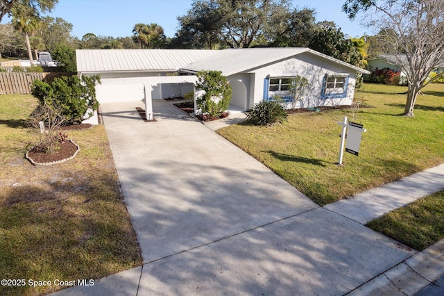 single story home with a garage and a front yard