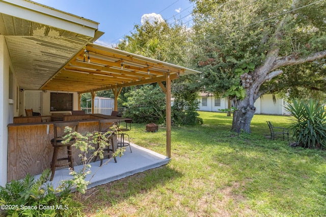 view of yard featuring a bar and a patio area