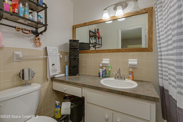 bathroom with toilet, tile walls, vanity, a shower with shower curtain, and decorative backsplash