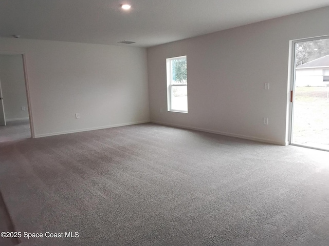 spare room featuring carpet flooring