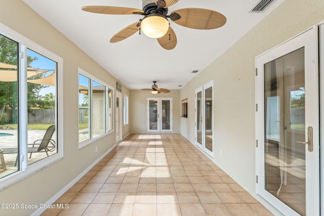 unfurnished sunroom with a wealth of natural light