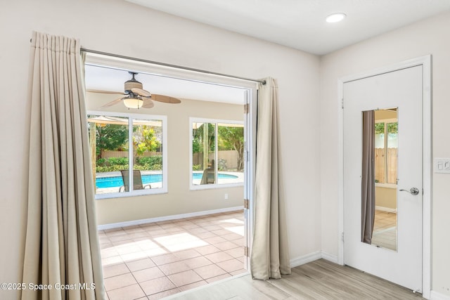 interior space featuring ceiling fan and light wood-type flooring