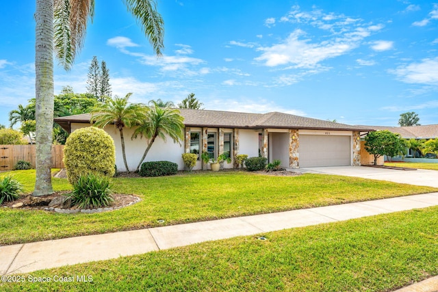 ranch-style home featuring a garage and a front lawn