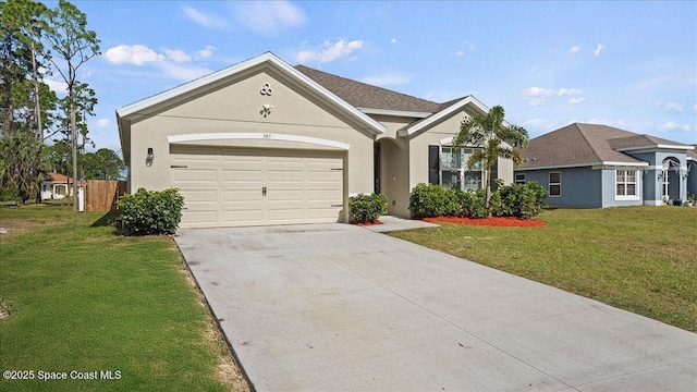 single story home featuring a garage and a front lawn