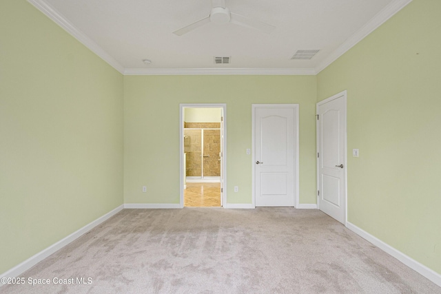 unfurnished room with crown molding, light colored carpet, and ceiling fan