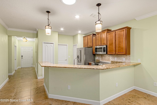 kitchen featuring stainless steel appliances, pendant lighting, decorative backsplash, and kitchen peninsula