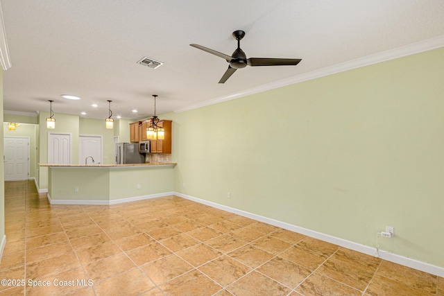 unfurnished living room featuring sink, light tile patterned floors, ornamental molding, and ceiling fan