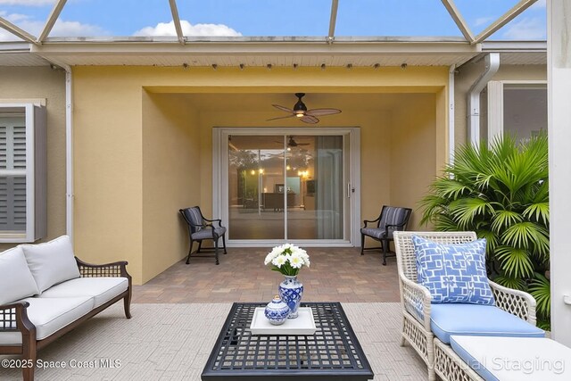 3765 Sansome Cir, Melbourne, FL 32940 - view of patio with an outdoor hangout area, glass enclosure, and ceiling fan