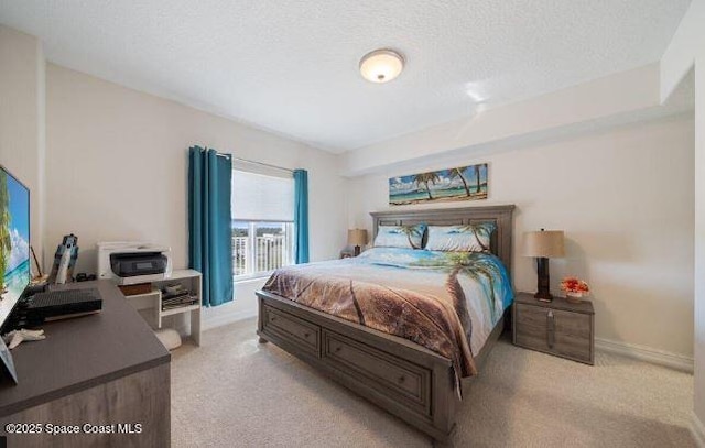 carpeted bedroom featuring a textured ceiling