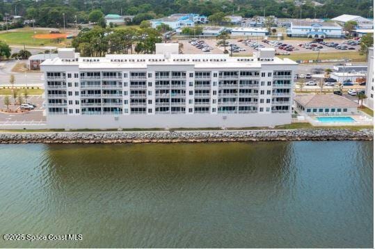 birds eye view of property with a water view