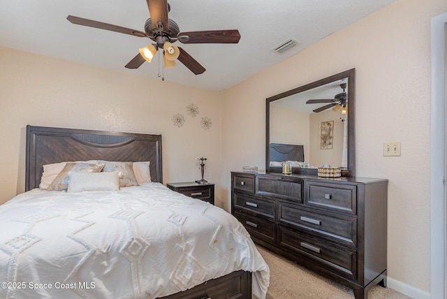 bedroom featuring ceiling fan and light colored carpet