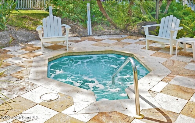 view of swimming pool with a patio area and an in ground hot tub