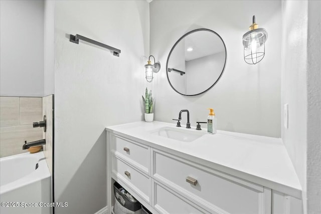 bathroom featuring vanity and washtub / shower combination