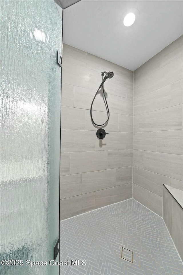 bathroom with a shower with shower door