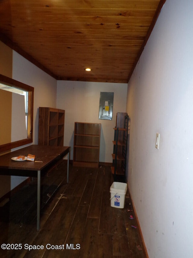 hall featuring dark hardwood / wood-style floors, wooden ceiling, and electric panel