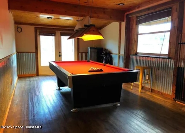 rec room featuring dark hardwood / wood-style floors, beam ceiling, and a wealth of natural light